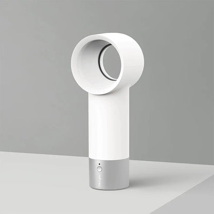 Compact, cordless, and bladeless fan with a sleek, white design and a powerful 900mAh battery for portable cooling.