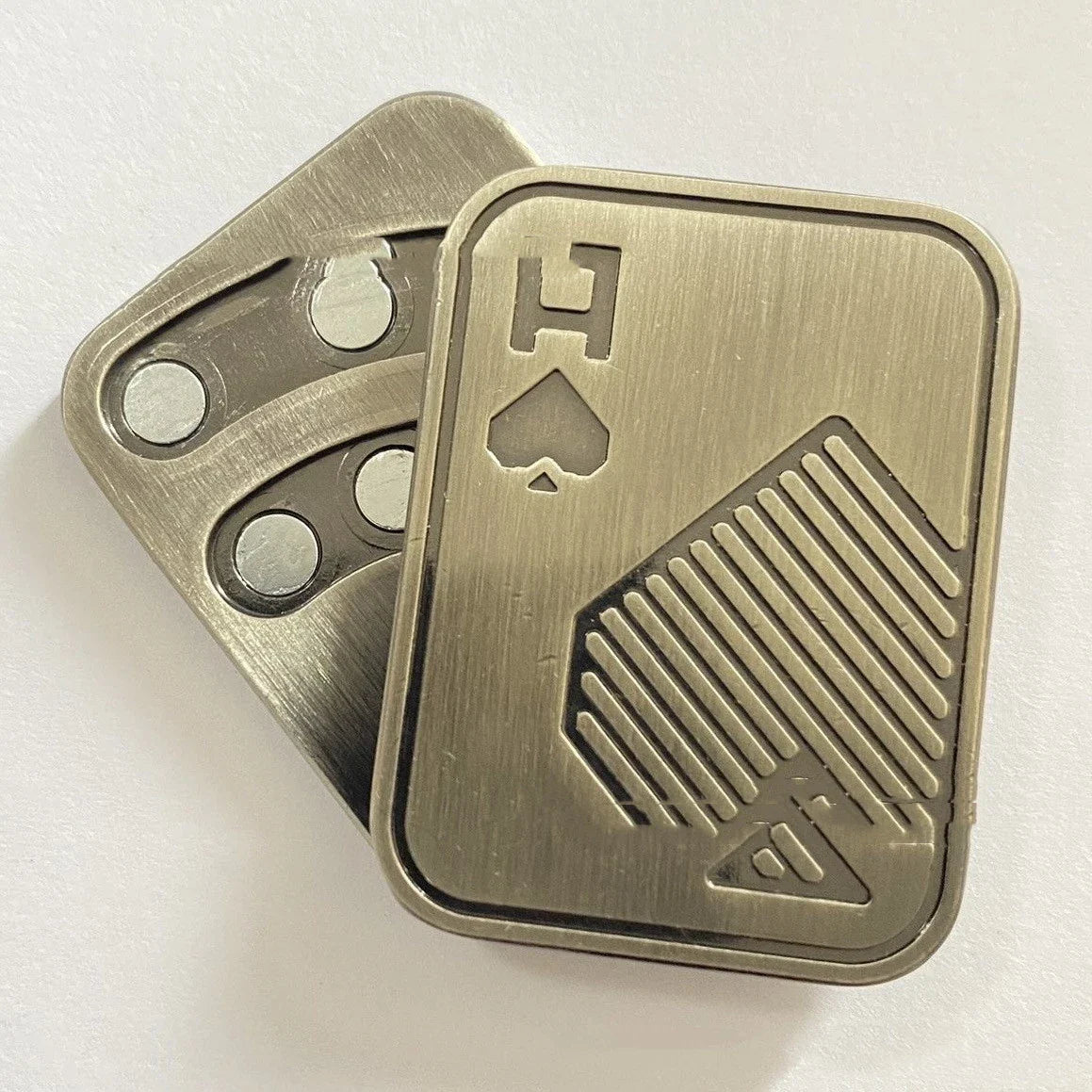 Premium British-made fingertip peg-top decompression toy in silver, copper, and skull designs
