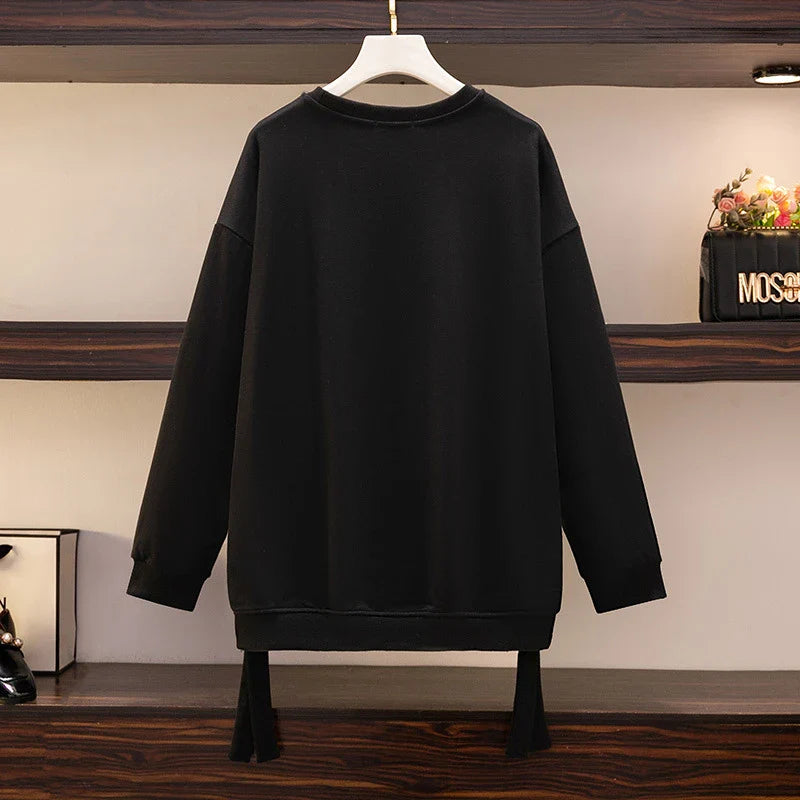 A premium ladies' round neck pullover in a versatile black colour, made from high-quality cotton for exceptional softness and comfort.