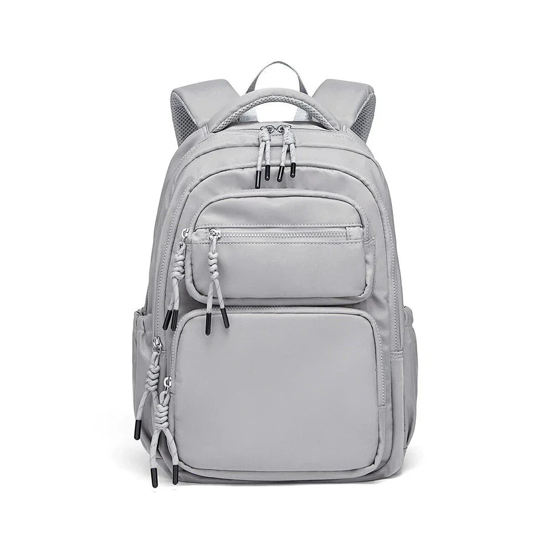 Premium leather backpack with dedicated laptop compartment, soft handles, and arcuate shoulder straps for modern women