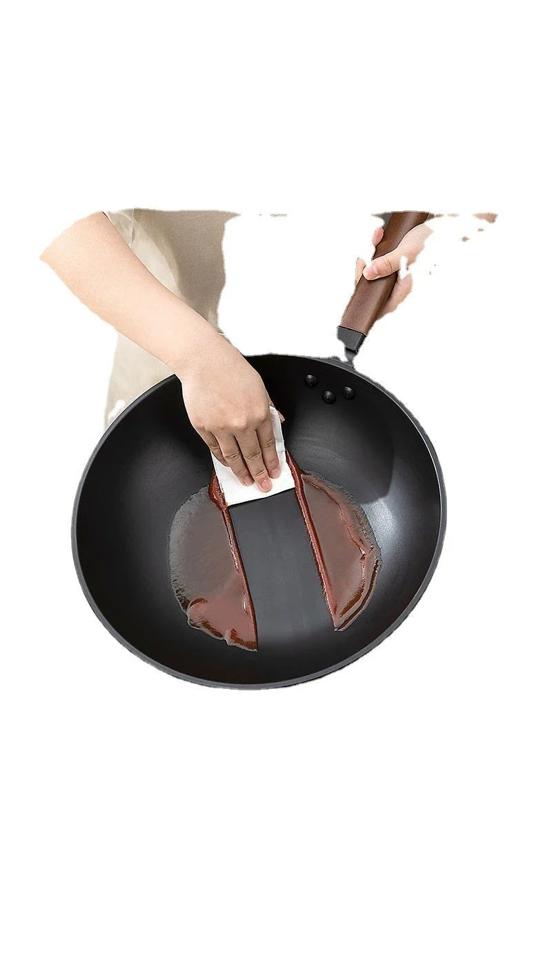 Premium quality refined iron wok with sleek, modern design for versatile cooking tasks