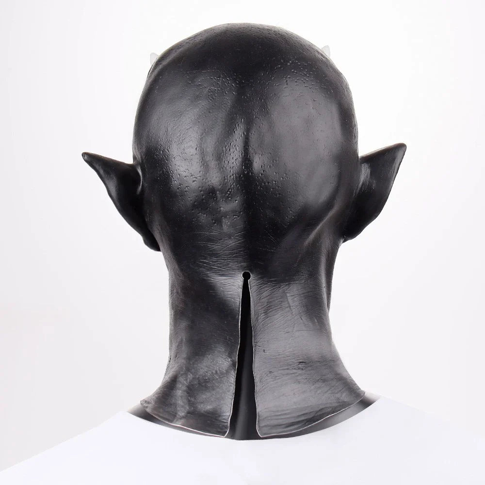 A close-up view of a black latex mask with twisted, menacing horns, creating a fearsome demonic appearance for Halloween costumes and parties.