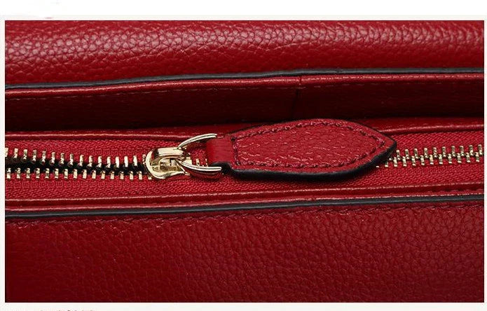 Premium first-layer cowhide leather shoulder bag with adjustable strap, spacious interior, and classic fashion design