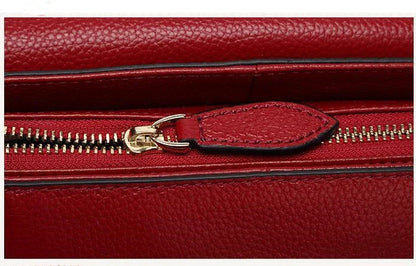 Premium first-layer cowhide leather shoulder bag with adjustable strap, spacious interior, and classic fashion design