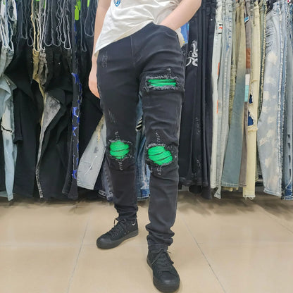 Premium ripped black jeans with stylish green patchwork design, made with medium-elastic fabric for comfort and a slim, flattering silhouette.