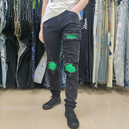 Premium ripped black jeans with stylish green patchwork design, made with medium-elastic fabric for comfort and a slim, flattering silhouette.