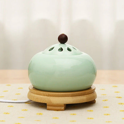 Elegant electric incense burner with adjustable temperature and timer function, perfect for creating a soothing ambiance in your home.