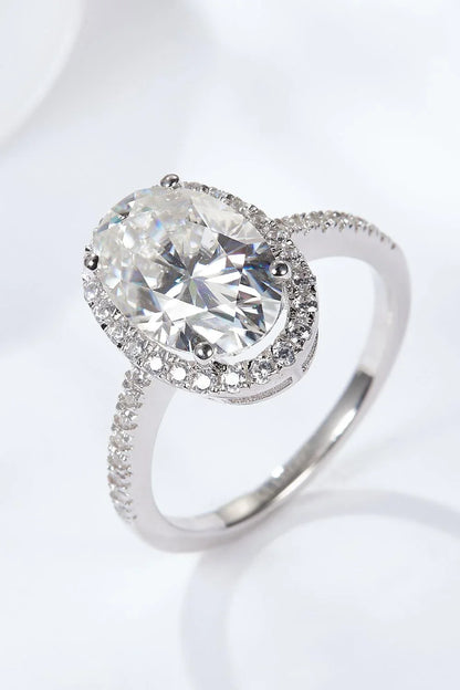 Elegant 4.5 carat moissanite halo ring in sterling silver with platinum plating, showcasing a captivating centre stone and delicate gem-studded design