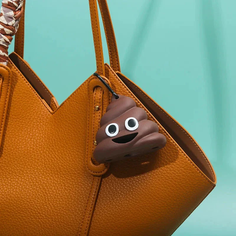 A brown leash-attached poop bag dispenser with a metal carabiner clip, designed for convenient pet waste management during outdoor activities.