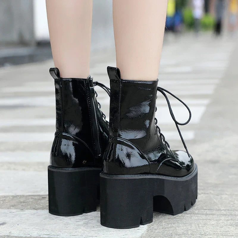 Premium lace-up high heel ankle boots in black, featuring a secure closure, supportive heel, and sleek, sophisticated silhouette.