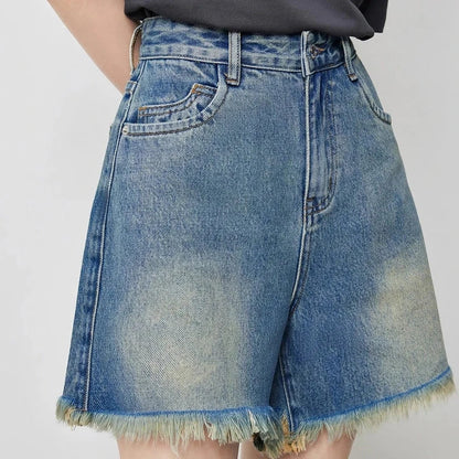 Vintage-inspired high-waisted denim shorts with tassel detailing for women