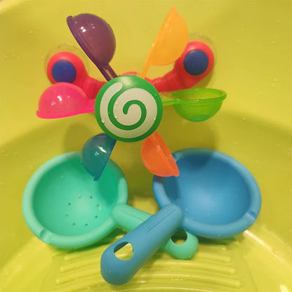 Colourful children's bath toy with a turning windmill and spoon for imaginative water play