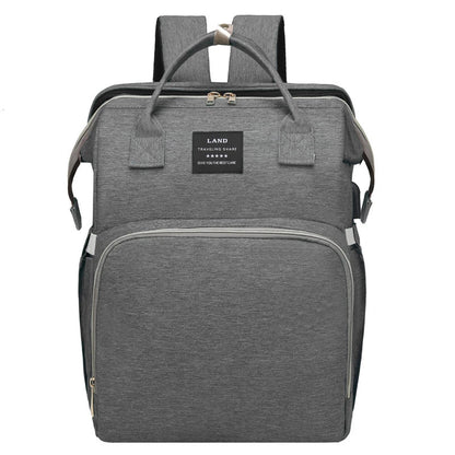 Multifunctional maternity diaper backpack with removable mosquito net, foldable crib, and water-resistant design for convenient family travel