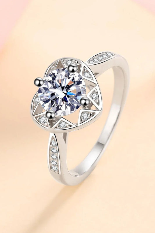 Elegant moissanite heart-shaped ring in sterling silver setting with zircon accent stones