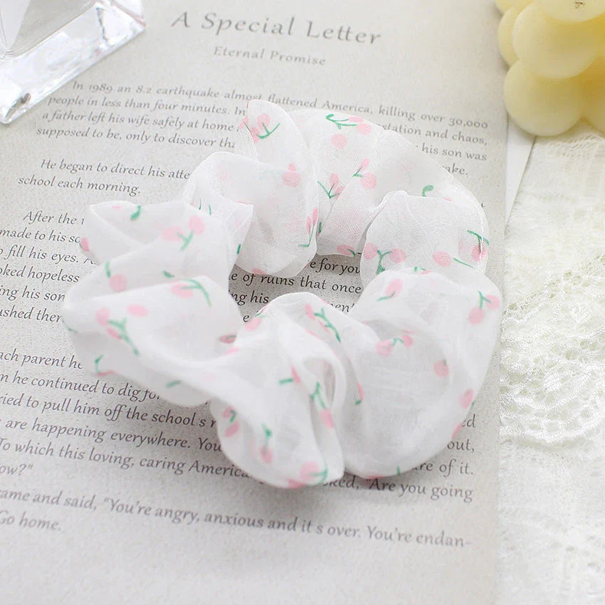 Handmade floral elastic hair bands with soft chiffon fabric and vibrant embroidered daisy patterns, perfect for enhancing everyday style in the UK.
