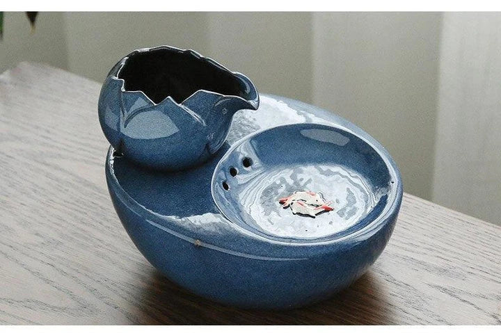 Elegant British-inspired ceramic drinking fountain with adjustable water flow and soothing ambiance