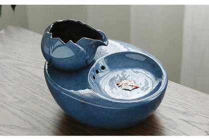 Elegant British-inspired ceramic drinking fountain with adjustable water flow and soothing ambiance