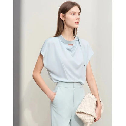 Elegant minimalist women's summer blouse in blue chiffon fabric with tie sleeves and hollow-out decoration