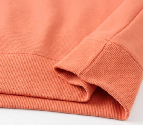 Premium heavyweight knitted jumper in a range of solid colours, made with soft cotton terry fabric for cosy comfort.