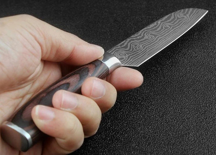 A set of three Japanese-style chef knives with stainless steel blades and ergonomic handles, perfect for slicing, dicing, and mincing in the kitchen.