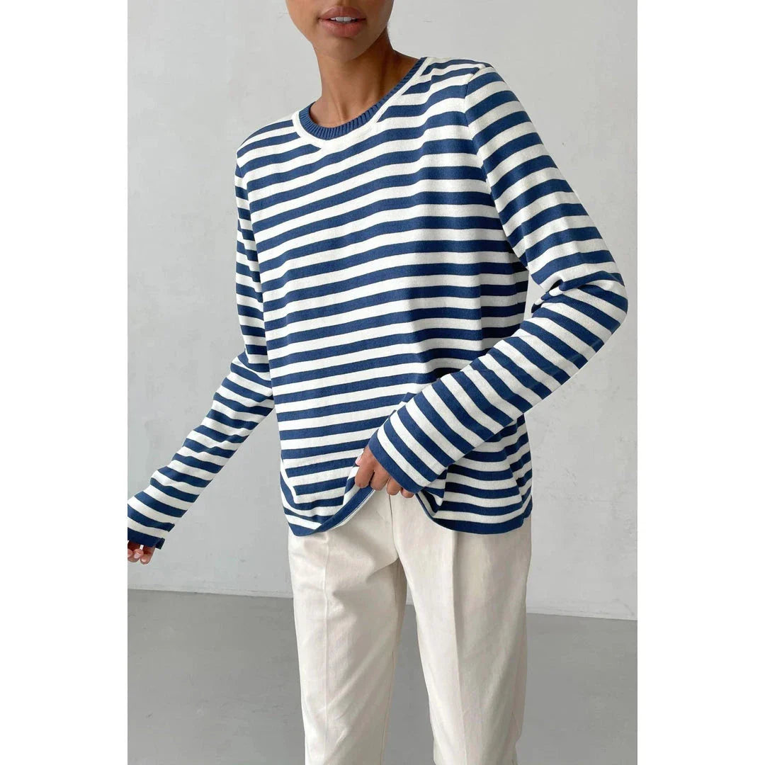 A cosy and stylish knitted stripe jumper for women, featuring a round neckline and full-length sleeves for warmth during the autumn and winter seasons.