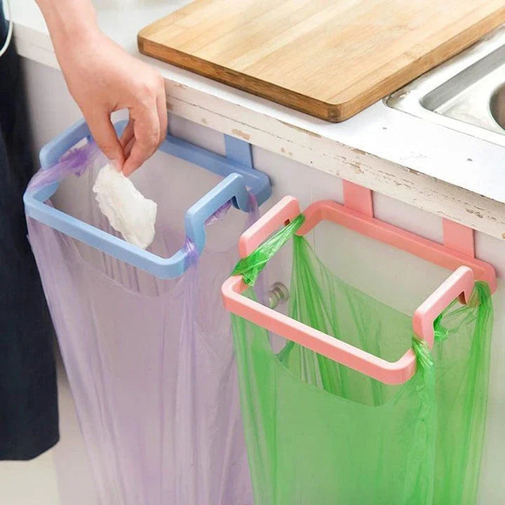 Cupboard-mounted trash bag holder in various colours for organising kitchen waste storage