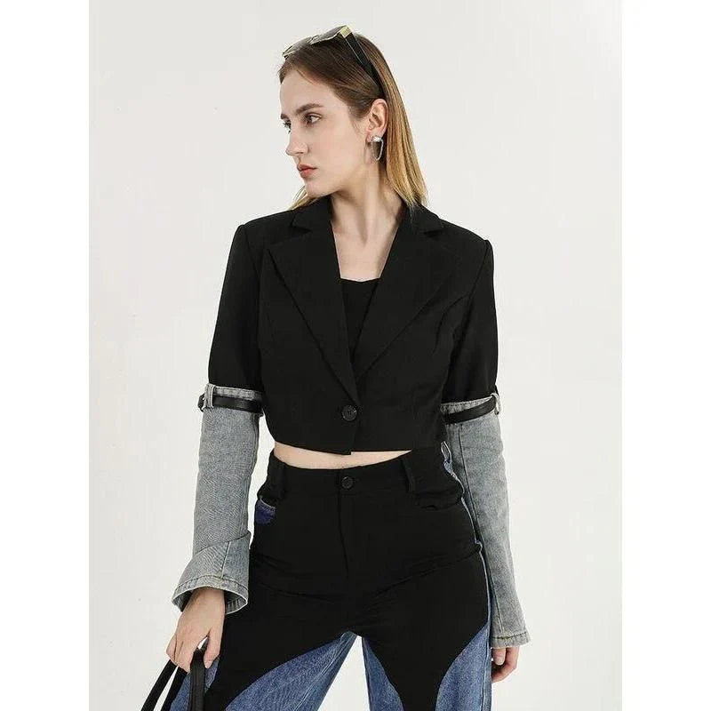 A stylish denim patchwork blazer with a notched collar and single-button closure, designed for the modern British woman