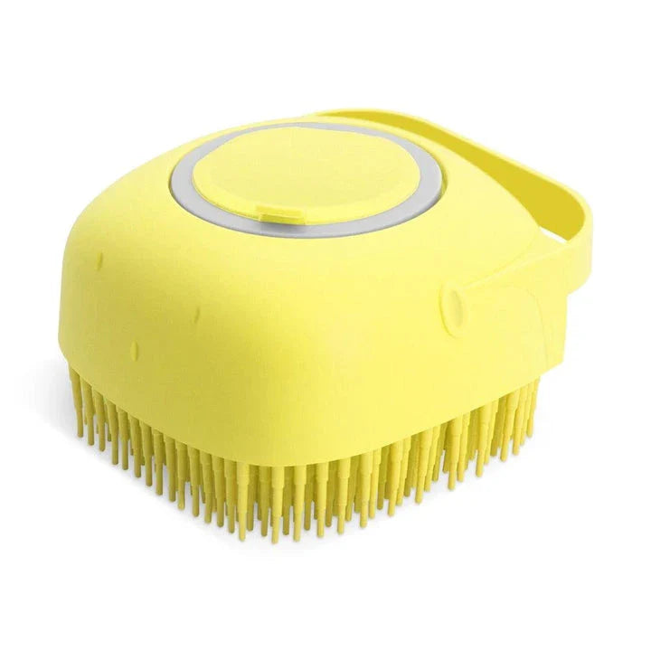 A yellow dog bath brush with a built-in shampoo dispenser and soft silicone bristles for a relaxing, spa-like bathing experience.