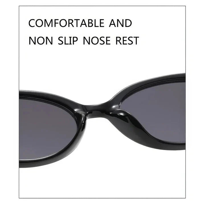 Oval-shaped women's sunglasses in a white and grey colour, offering UV protection and a stylish, retro-inspired design.