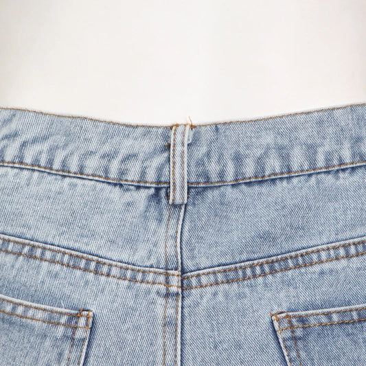 High-waisted wide-leg denim trousers in a stylish blue colour, featuring a comfortable and flattering fit