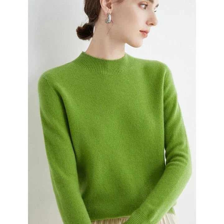 A woman wearing a luxurious Merino wool mock-neck jumper in a stylish autumnal outfit