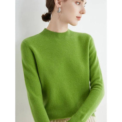 A woman wearing a luxurious Merino wool mock-neck jumper in a stylish autumnal outfit