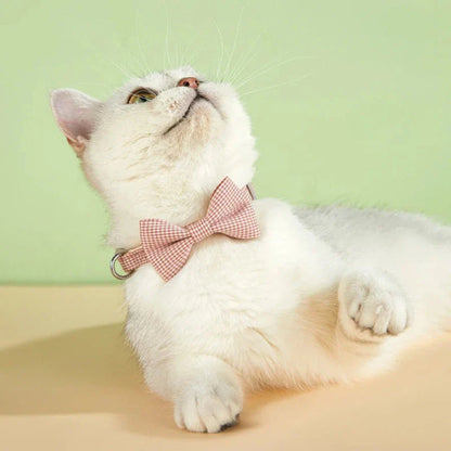 Stylish checkered pet collar with elegant butterfly knot decoration, perfect for dressing up cats and dogs