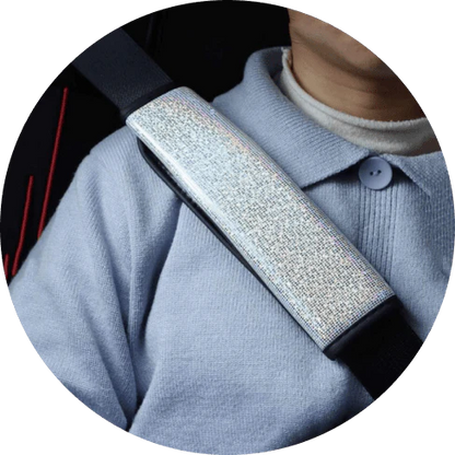 Multicoloured bling seat belt covers in a car, adding a touch of glamour and personality to the interior