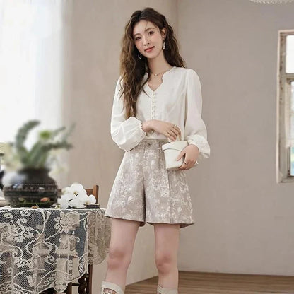 Elegant high-waisted floral jacquard A-line shorts with chic metal buttons, perfect for any occasion