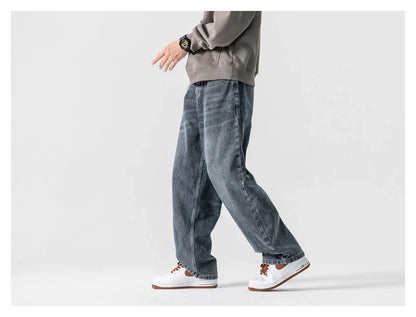 A pair of stylish retro-inspired Japanese jeans in black and grey, featuring a mid-rise waist and straight leg silhouette for a flattering, comfortable fit.
