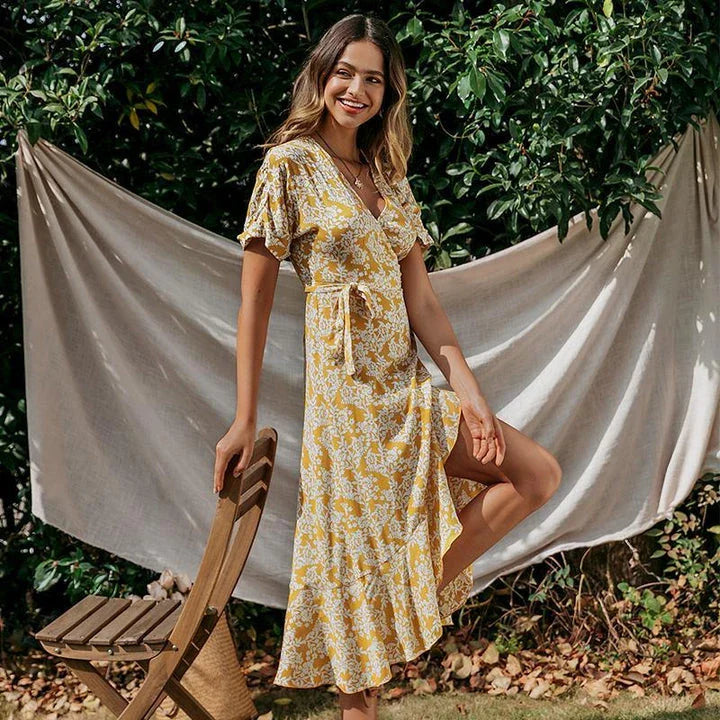 Elegant floral lace ruffle dress in yellow, featuring a cascading ruffled skirt and delicate lace overlay for a refined, British-inspired look.