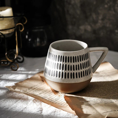 A hand-painted ceramic mug featuring a unique Nordic-inspired design, perfect for enjoying coffee, tea, or other beverages