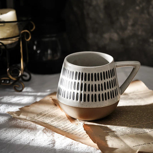 A hand-painted ceramic mug featuring a unique Nordic-inspired design, perfect for enjoying coffee, tea, or other beverages