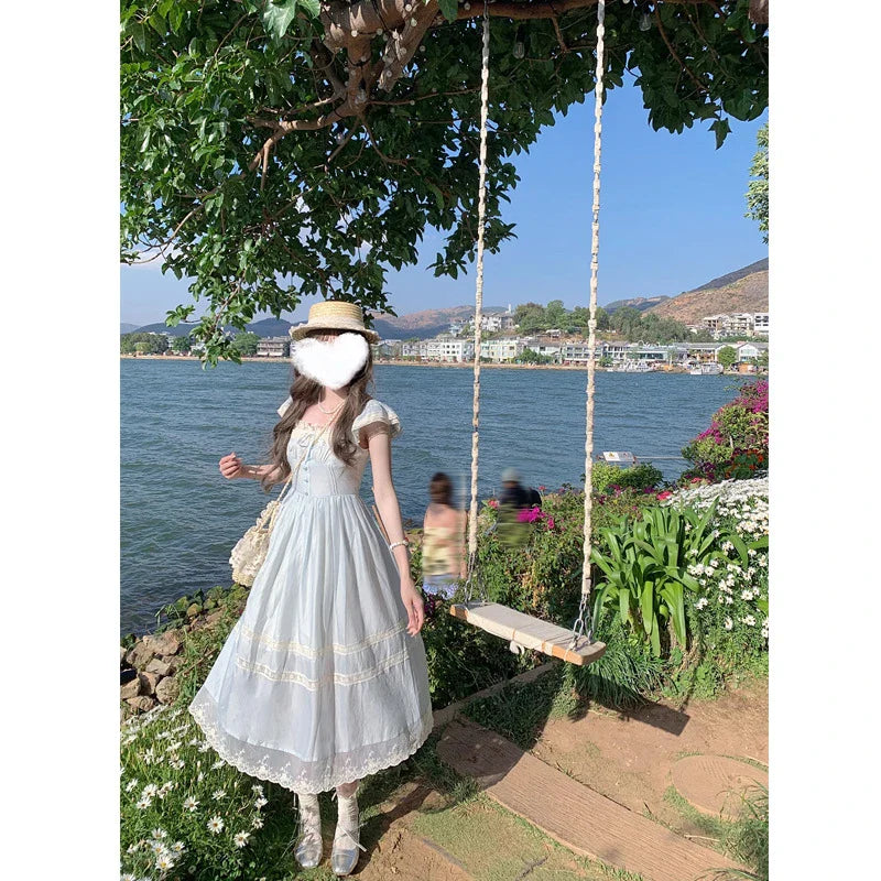 Elegant lace bow blue long dress for stylish ladies, featuring a high-waisted design and sleeveless silhouette for a sophisticated formal look.
