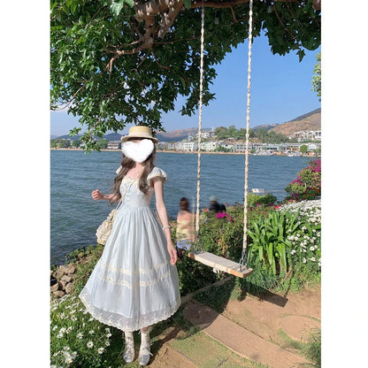 Elegant lace bow blue long dress for stylish ladies, featuring a high-waisted design and sleeveless silhouette for a sophisticated formal look.