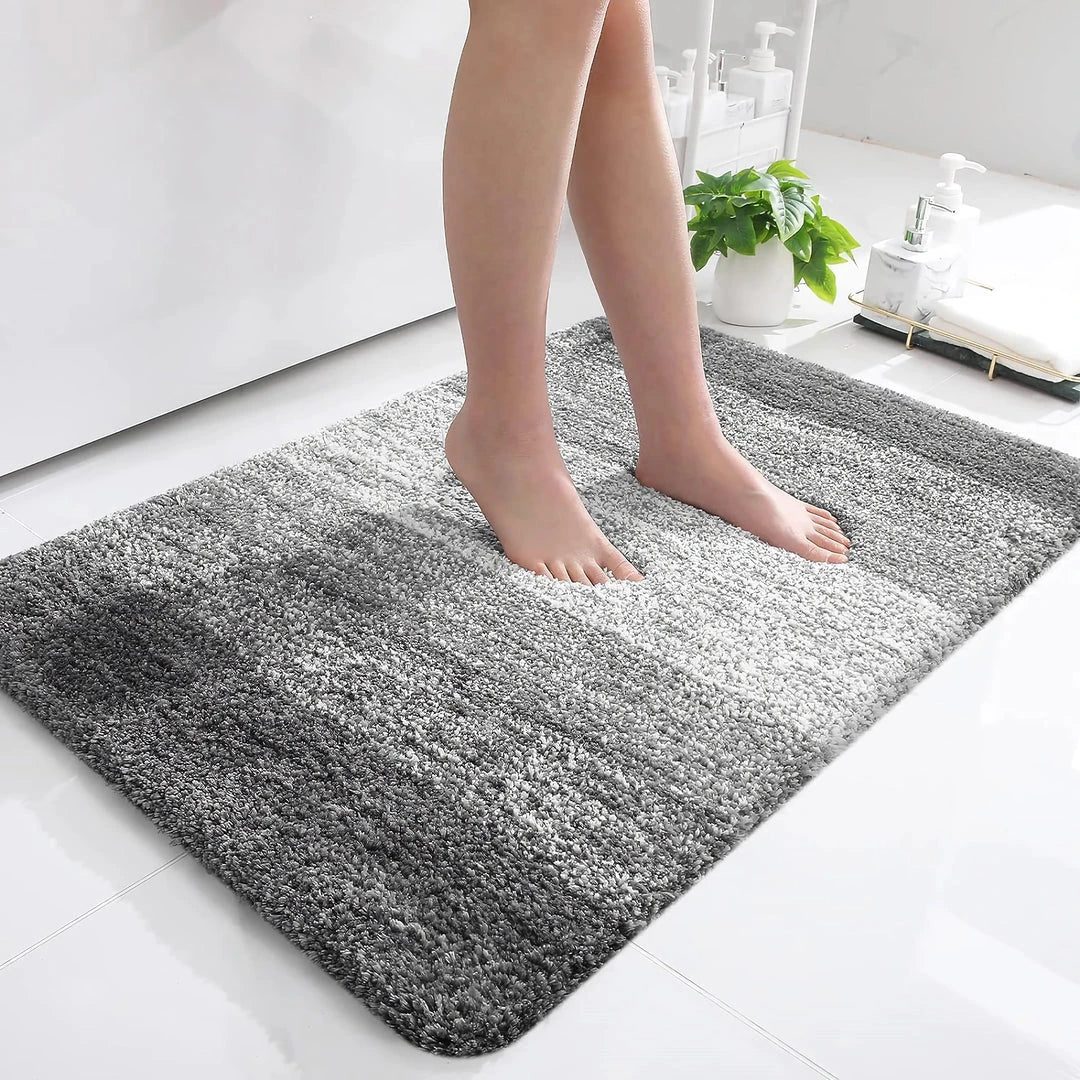 Luxurious microfibre absorbent bath mat in grey, featuring soft coral velvet surface and high-density memory foam cushioning