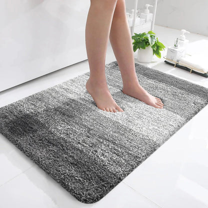 Luxurious microfibre absorbent bath mat in grey, featuring soft coral velvet surface and high-density memory foam cushioning