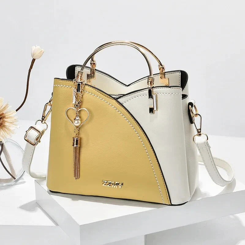 Sophisticated navy blue PU leather bucket crossbody bag with elegant patchwork design and adjustable strap