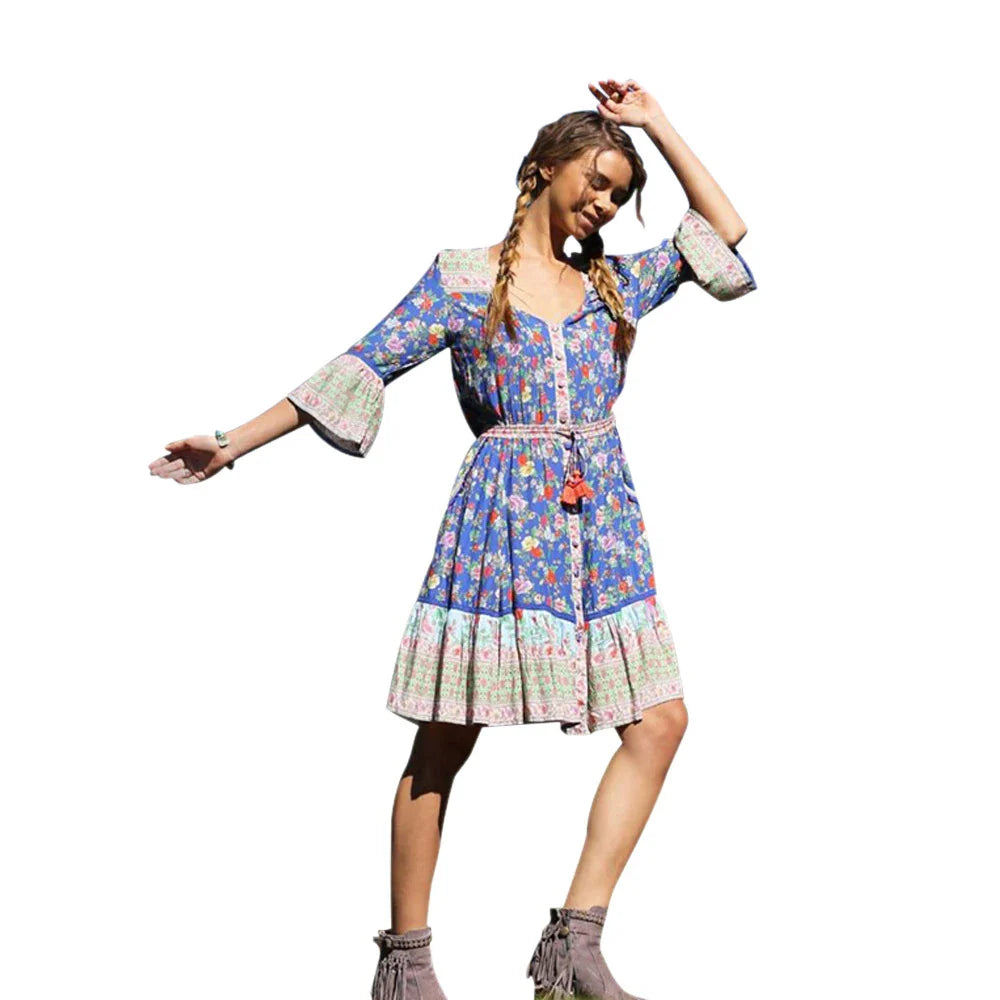 Elegant Bohemian-inspired pleated print dress in a vibrant pink colour, perfect for a day at the British seaside resort.