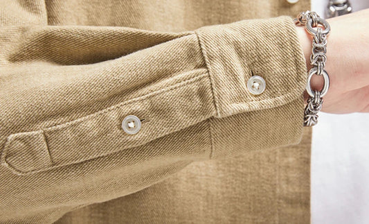 A relaxed, loose-fitting men's shirt in a retro-inspired design, crafted from premium cotton for exceptional comfort and style.