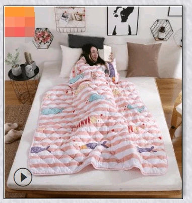 A cosy, wearable quilt with sleeves in a variety of colourful designs, perfect for staying warm and comfortable during the winter months.