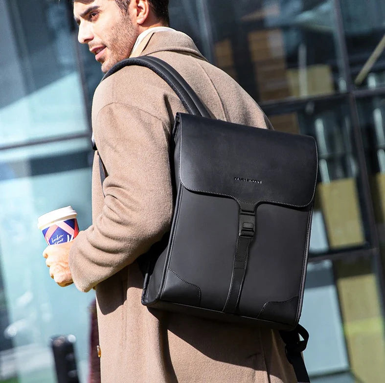Stylish magnetic buckle laptop backpack for men, featuring a sleek design, spacious interior, and durable PU leather construction.