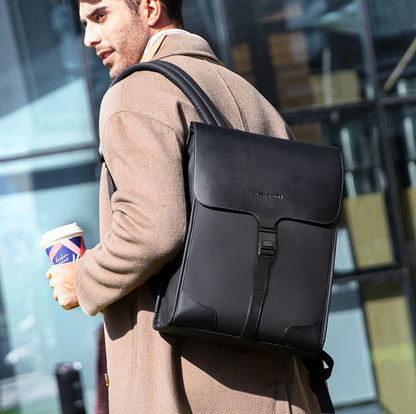 Stylish magnetic buckle laptop backpack for men, featuring a sleek design, spacious interior, and durable PU leather construction.