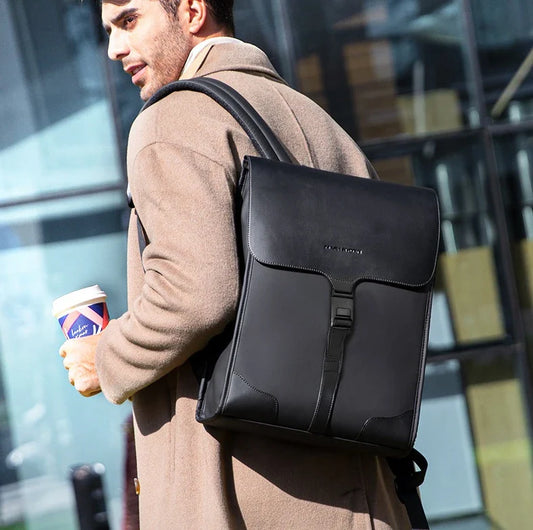 Stylish magnetic buckle laptop backpack for men, featuring a sleek design, spacious interior, and durable PU leather construction.